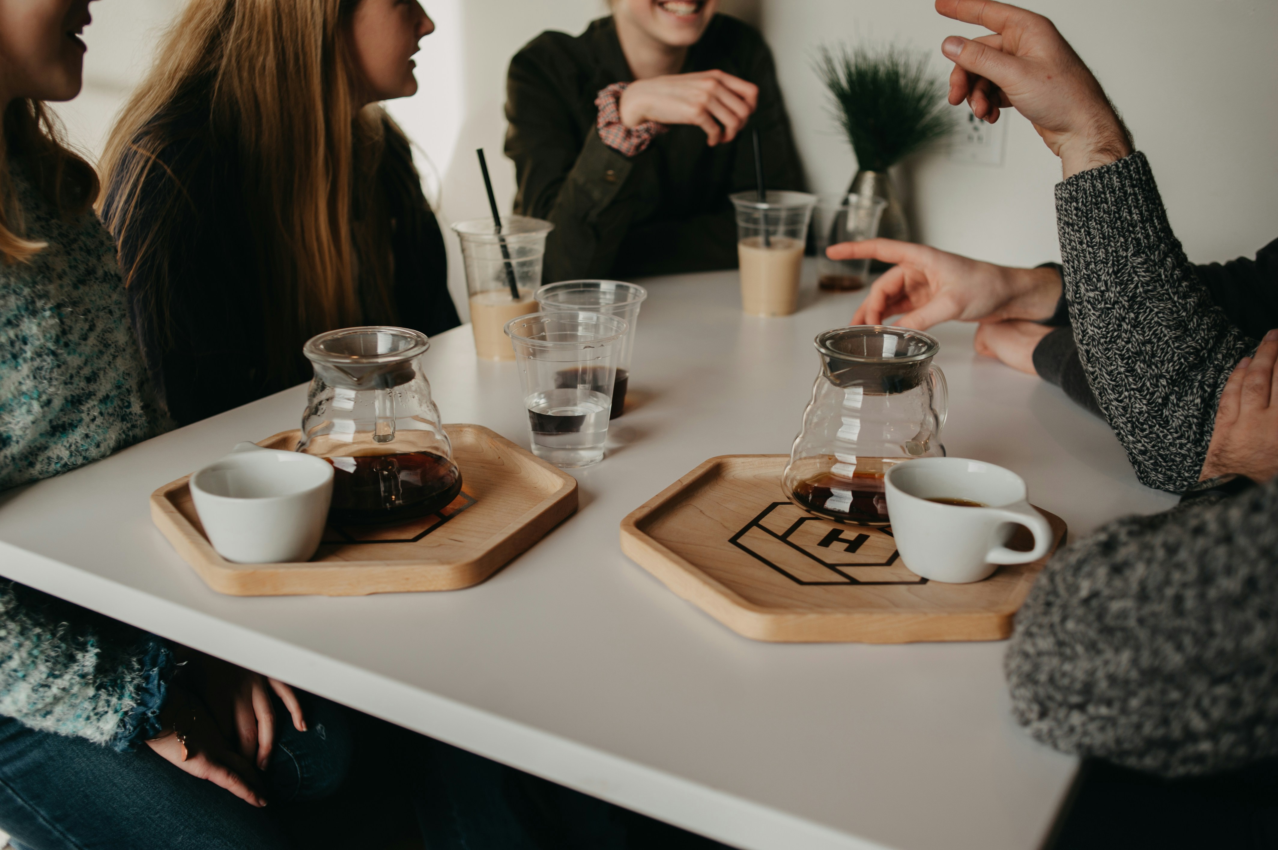 Group of people talking over coffee in Málaga